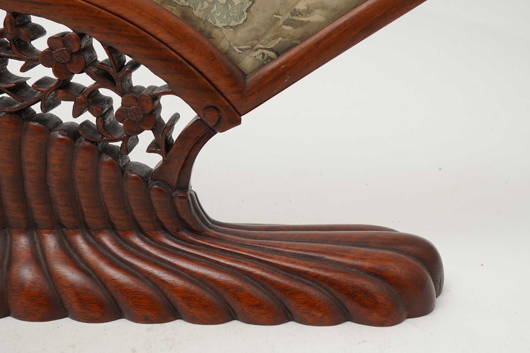 A Chinese painted paper fan leaf, 19th century, with hongmu frame and stand, early 20th century